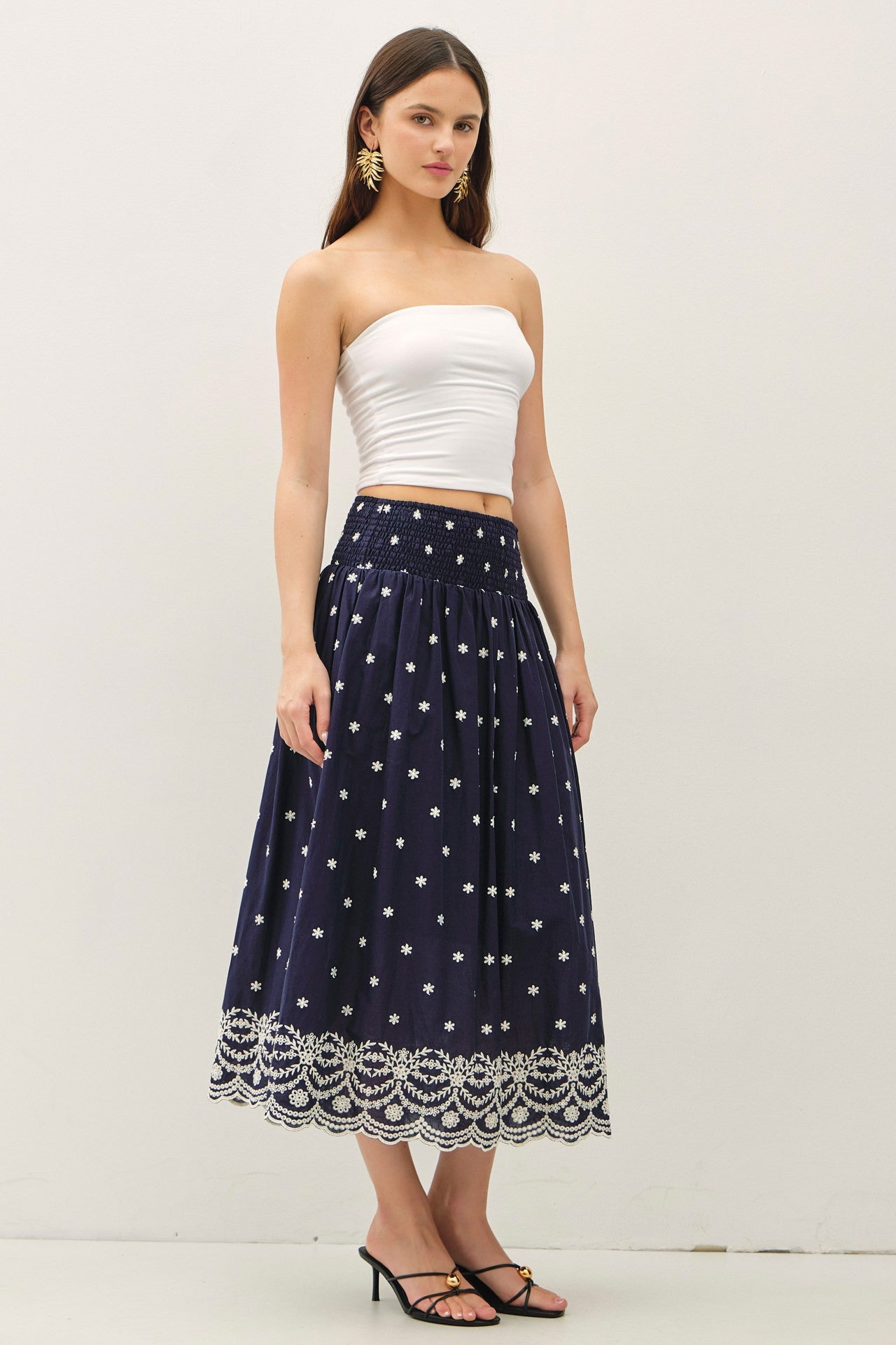 embroidered midi skirt with a scalloped hem and flowy high-waist silhouette