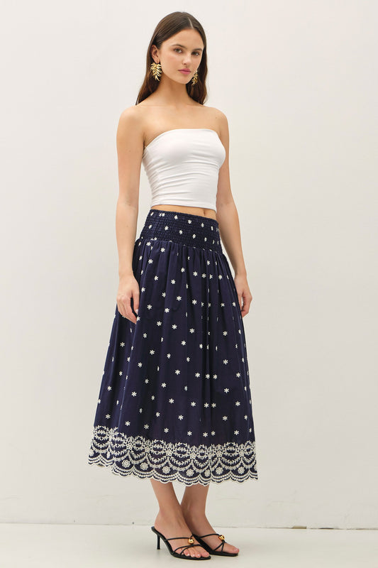 embroidered midi skirt with a scalloped hem and flowy high-waist silhouette