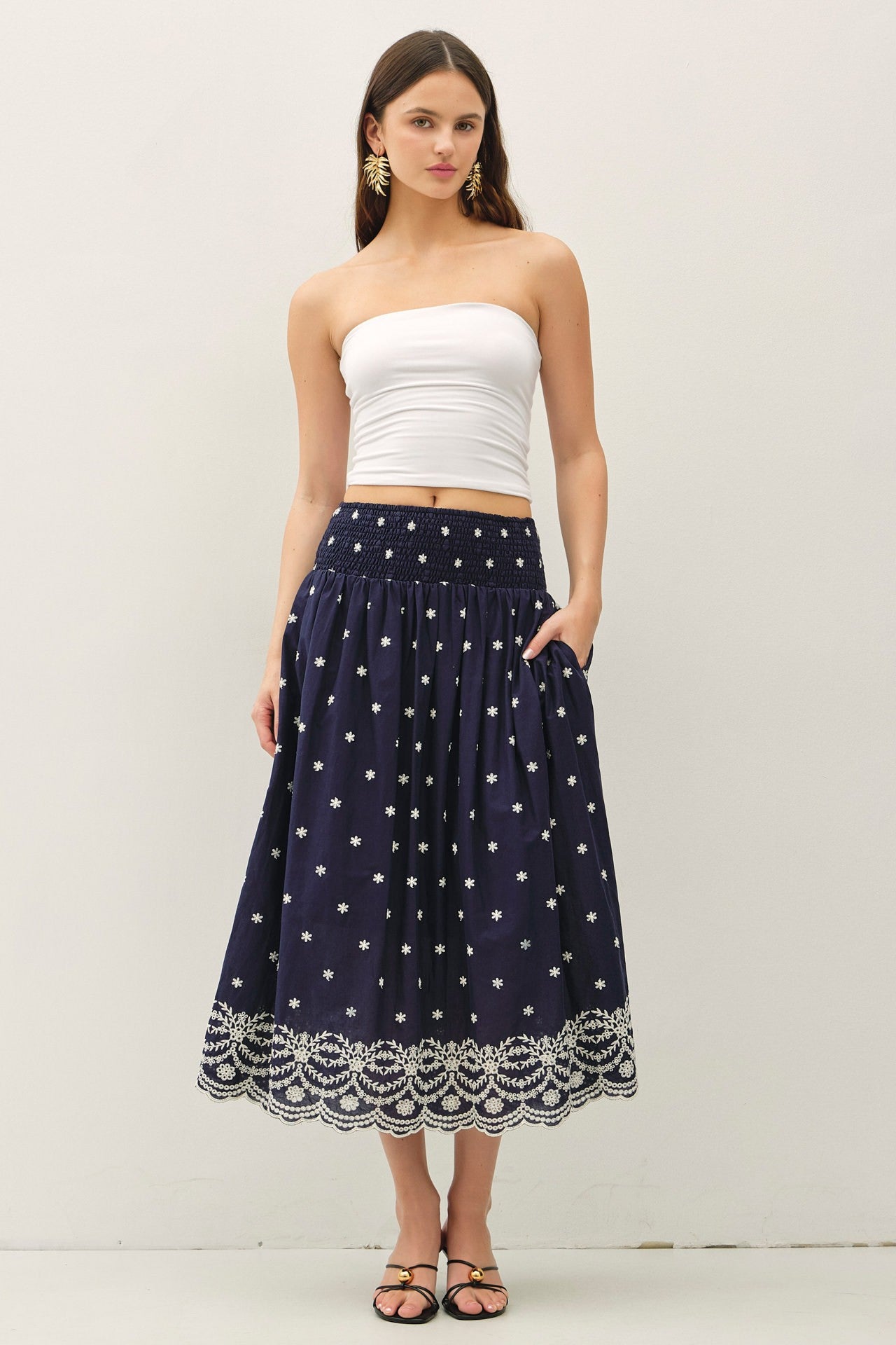 embroidered midi skirt with a scalloped hem and flowy high-waist silhouette