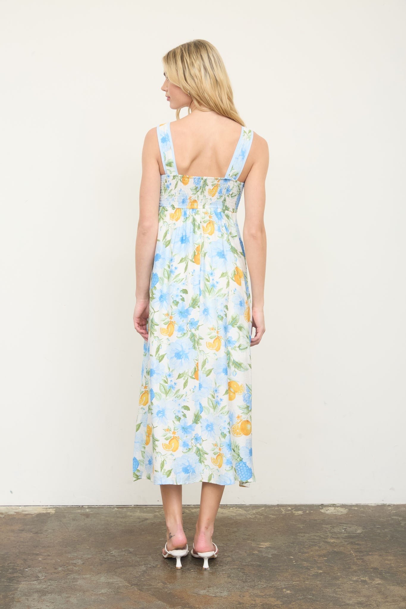 Floral Midi Dress features a sleeveless A-line silhouette, square neckline, and playful floral-and-fruit pattern