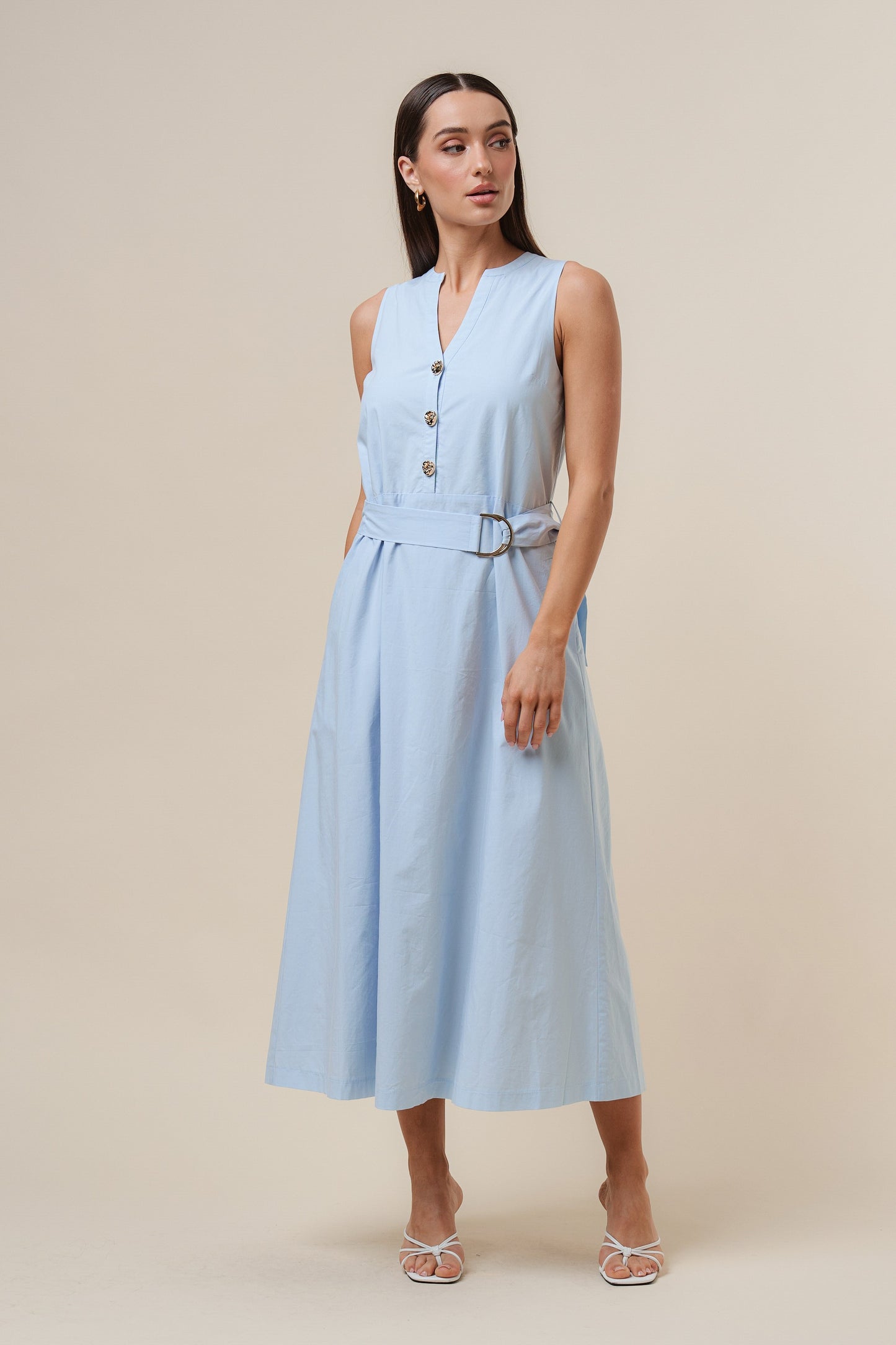 D-Ring Maxi Dress features a sleeveless silhouette with a self-tie belt, gold metal D-ring, and button details