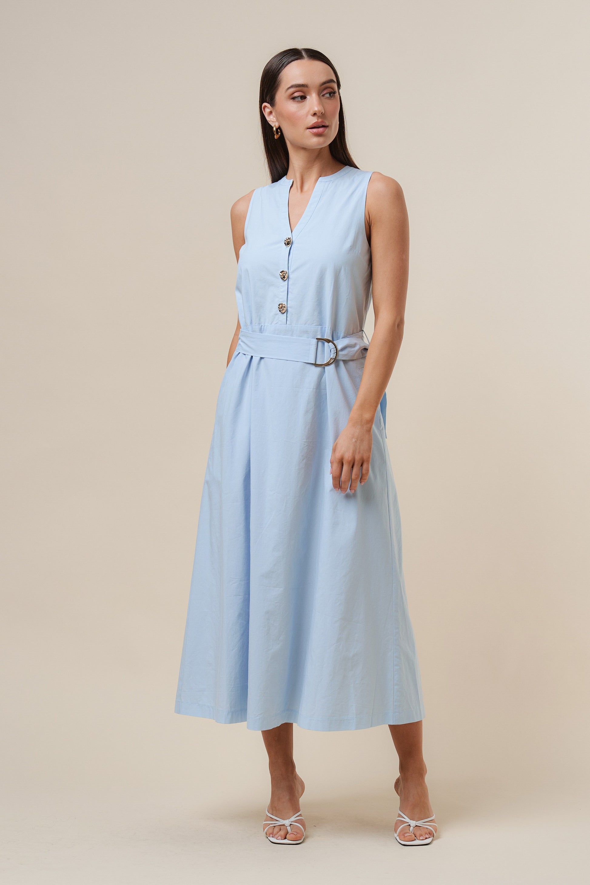 D-Ring Maxi Dress features a sleeveless silhouette with a self-tie belt, gold metal D-ring, and button details