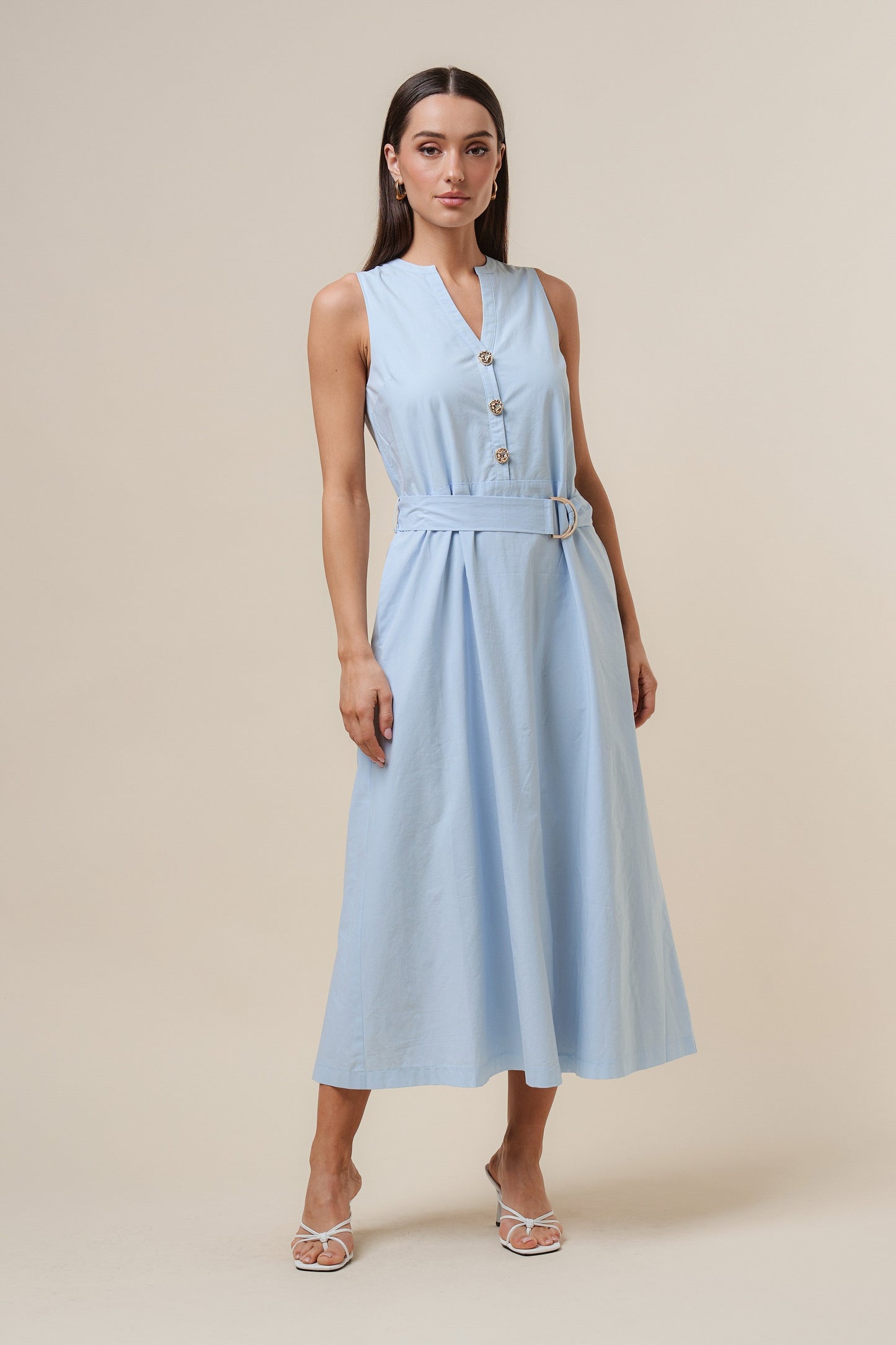 D-Ring Maxi Dress features a sleeveless silhouette with a self-tie belt, gold metal D-ring, and button details