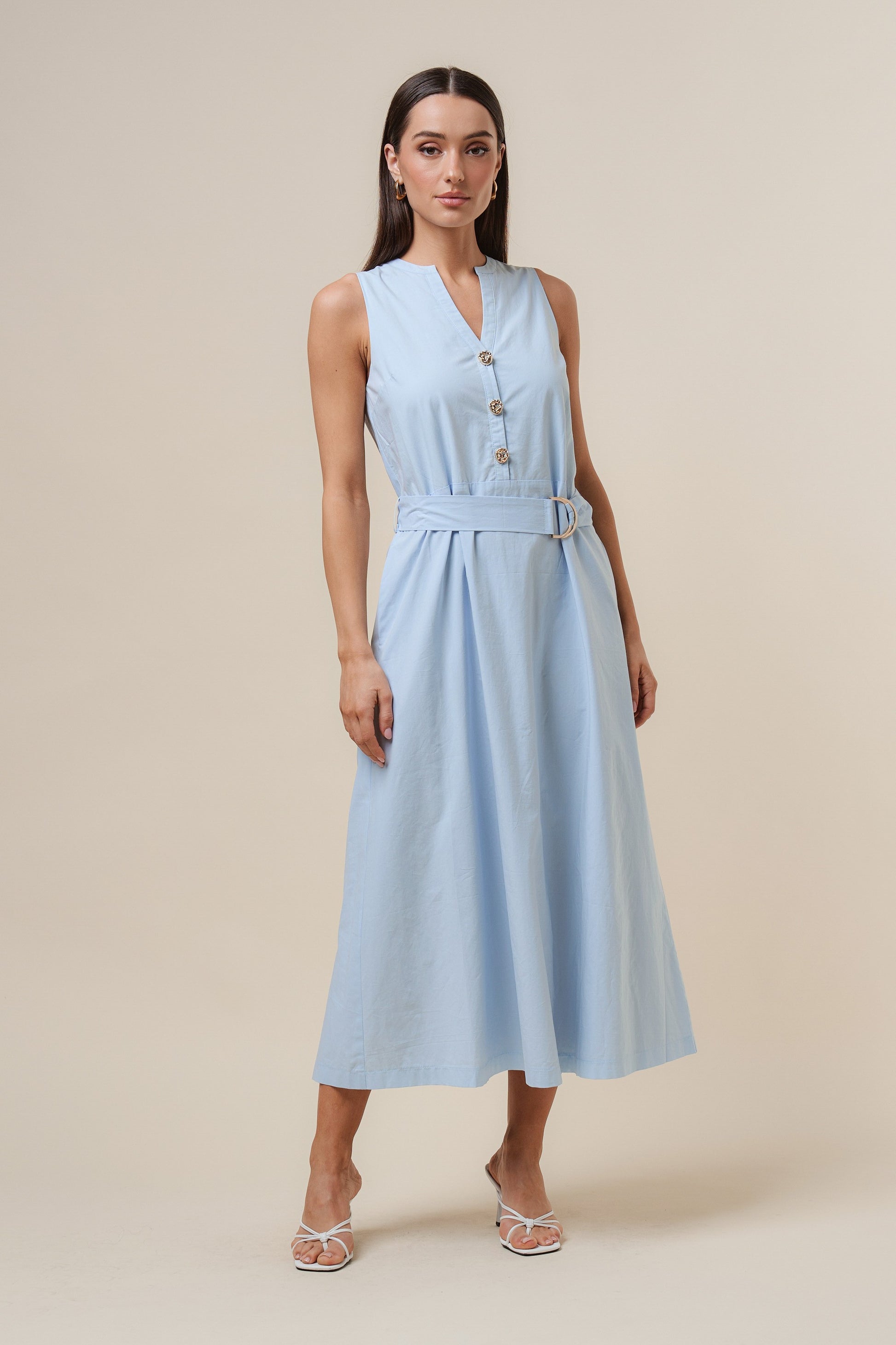 D-Ring Maxi Dress features a sleeveless silhouette with a self-tie belt, gold metal D-ring, and button details