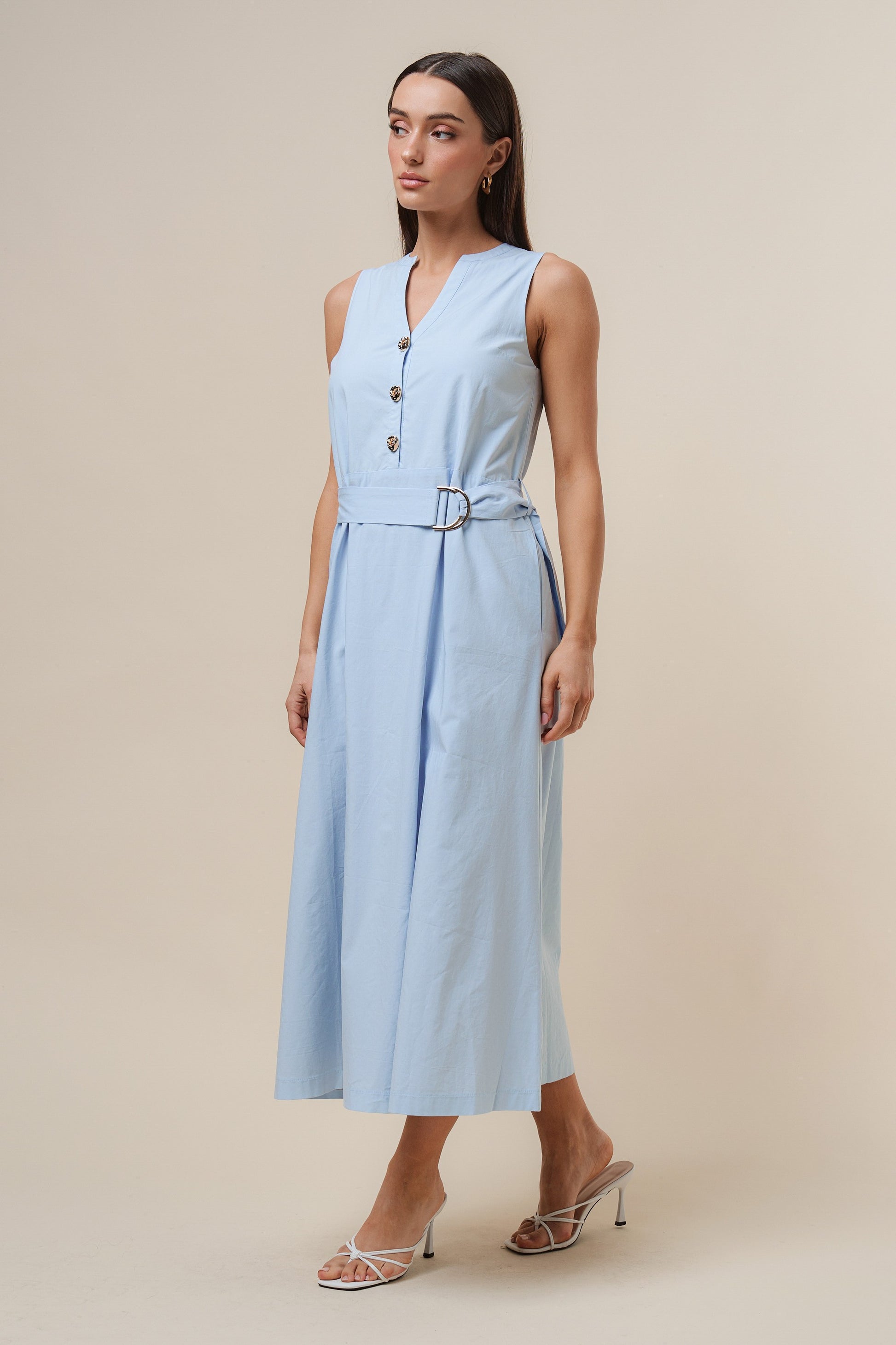 D-Ring Maxi Dress features a sleeveless silhouette with a self-tie belt, gold metal D-ring, and button details