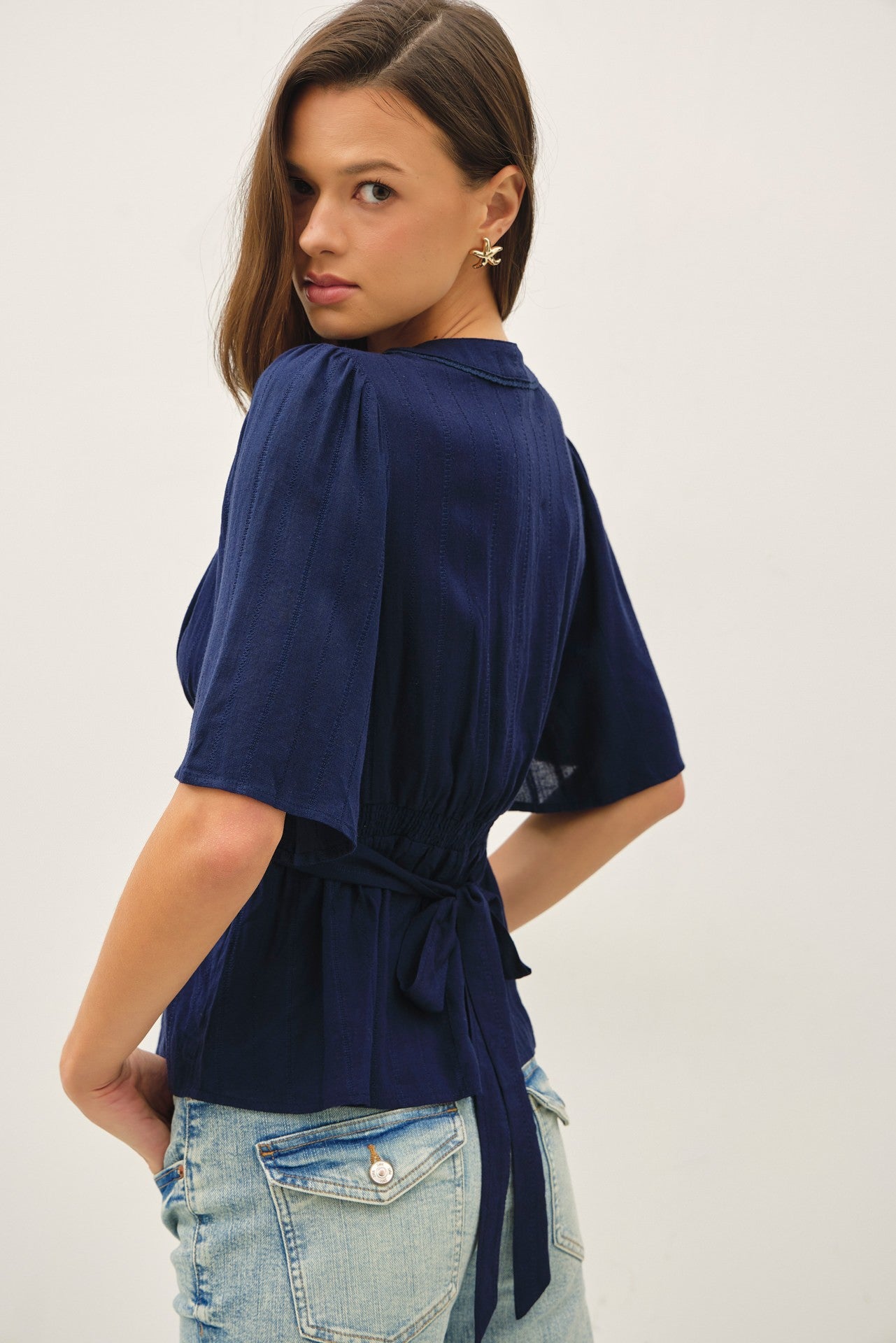 Navy kimono sleeve blouse with a flattering empire waist 