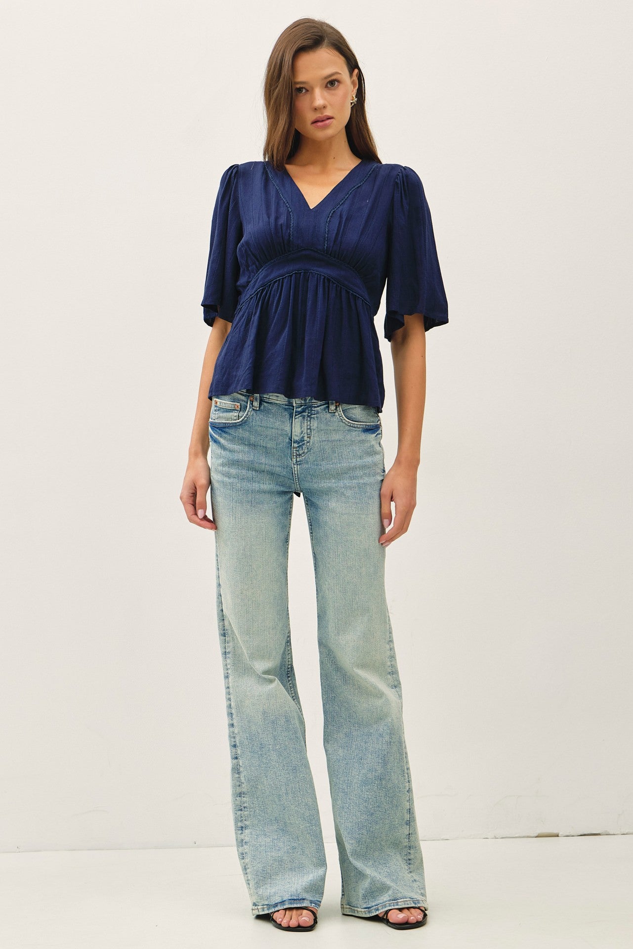 Navy kimono sleeve blouse with a flattering empire waist 
