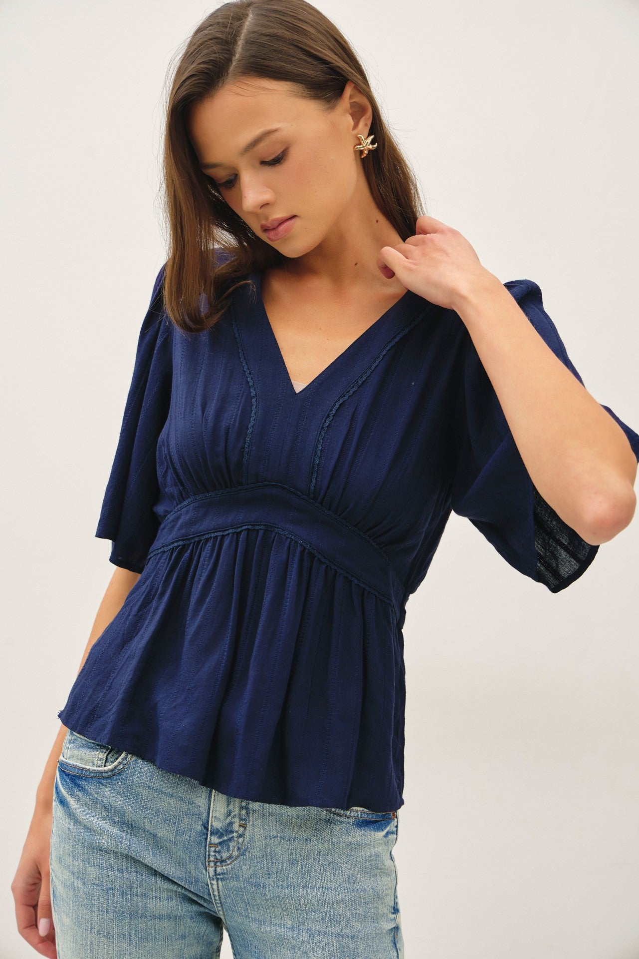 Navy kimono sleeve blouse with a flattering empire waist 