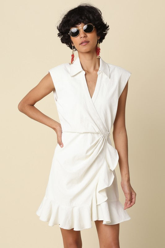 wrap mini dress featuring soft draping and a feminine ruffle hem