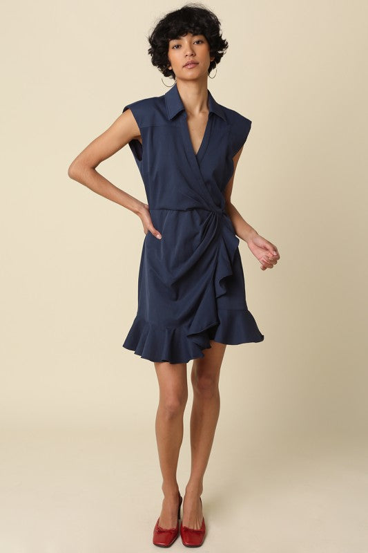 wrap mini dress featuring soft draping and a feminine ruffle hem