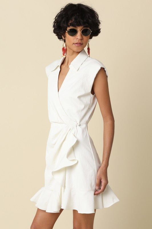 wrap mini dress featuring soft draping and a feminine ruffle hem