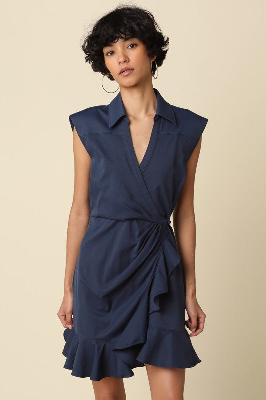 wrap mini dress featuring soft draping and a feminine ruffle hem