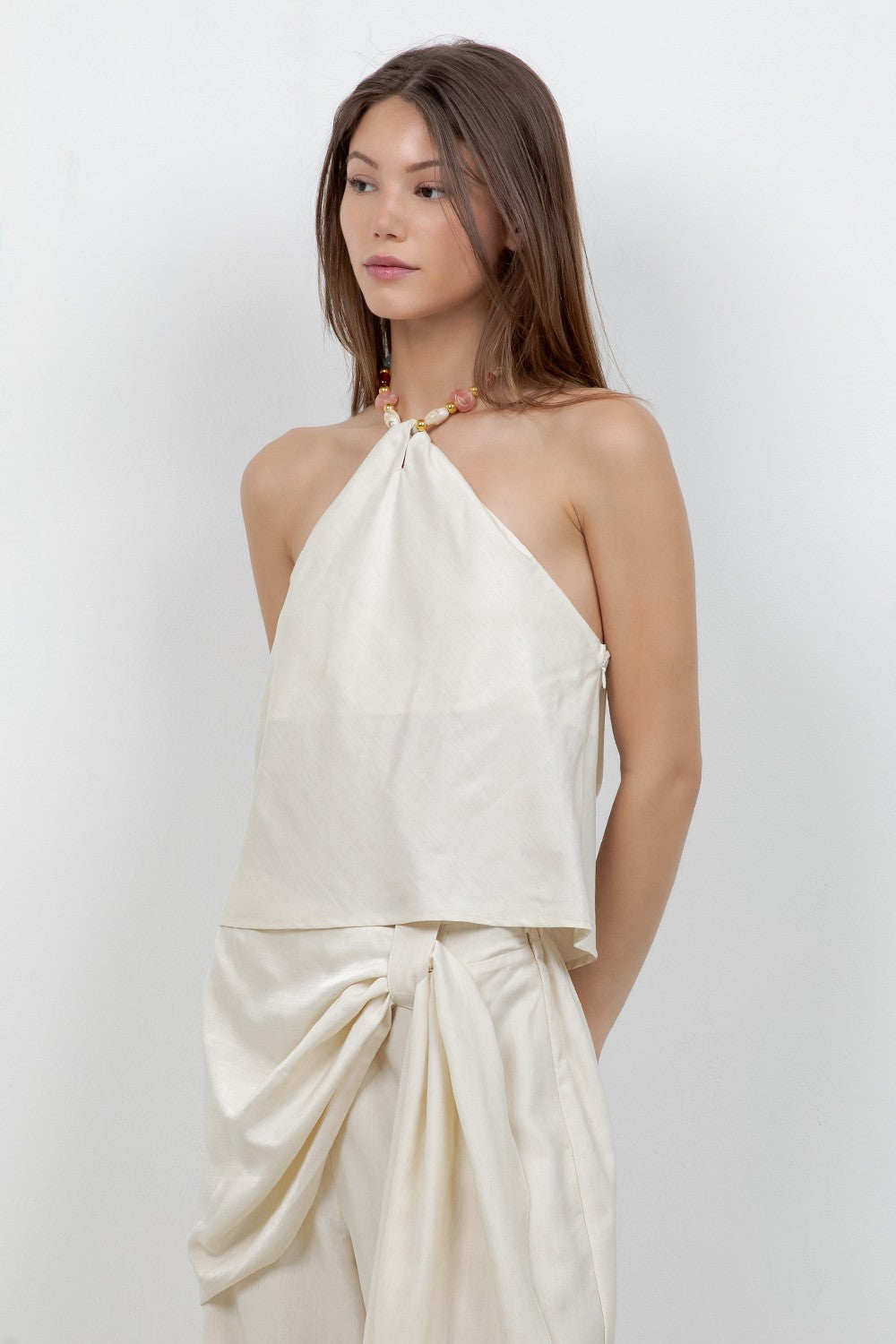 eaded Halter Top features a soft woven fabric with elegant bead accents