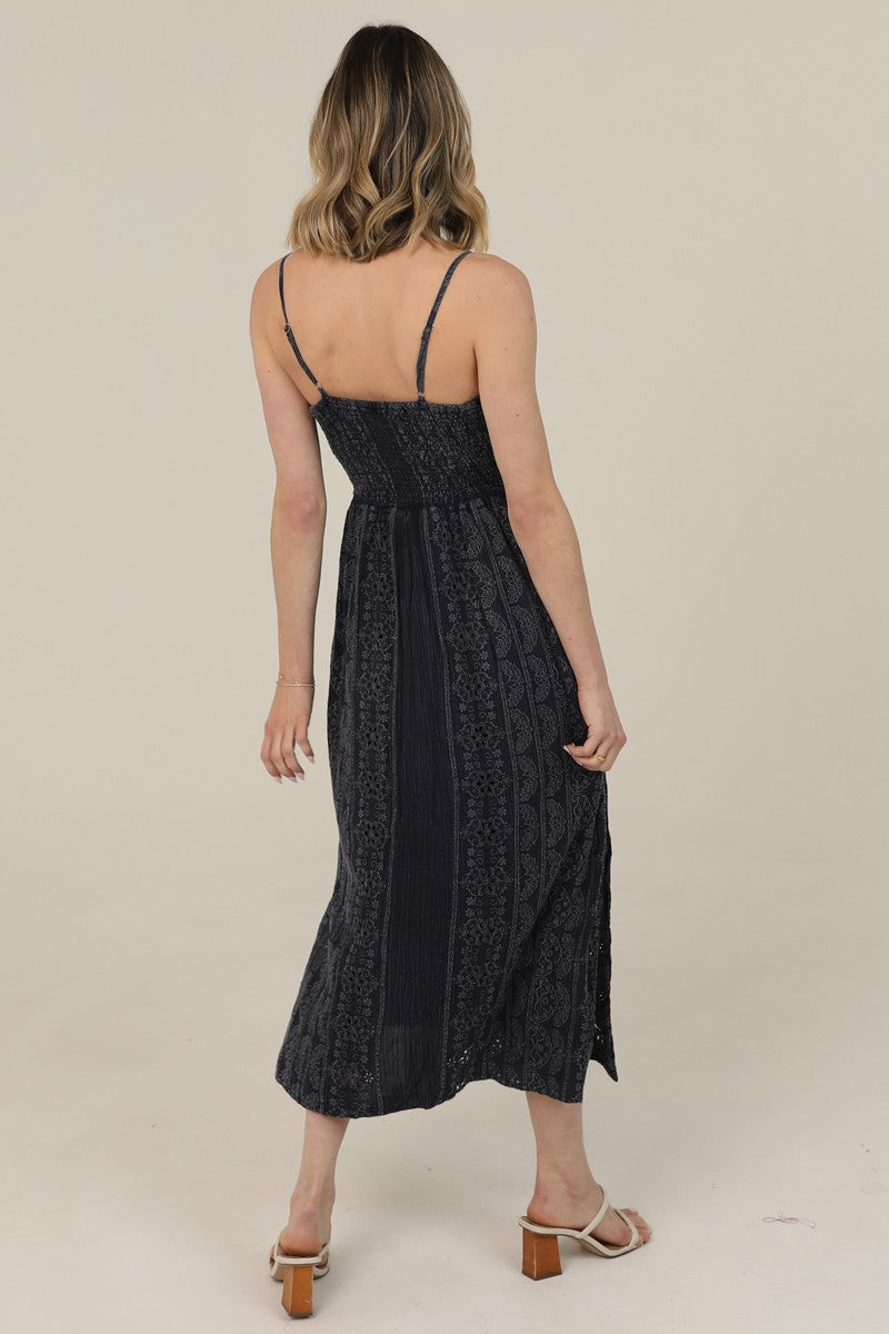  Midi Dress features a twist-front bodice, cutout detail, and eyelet embroidery 
