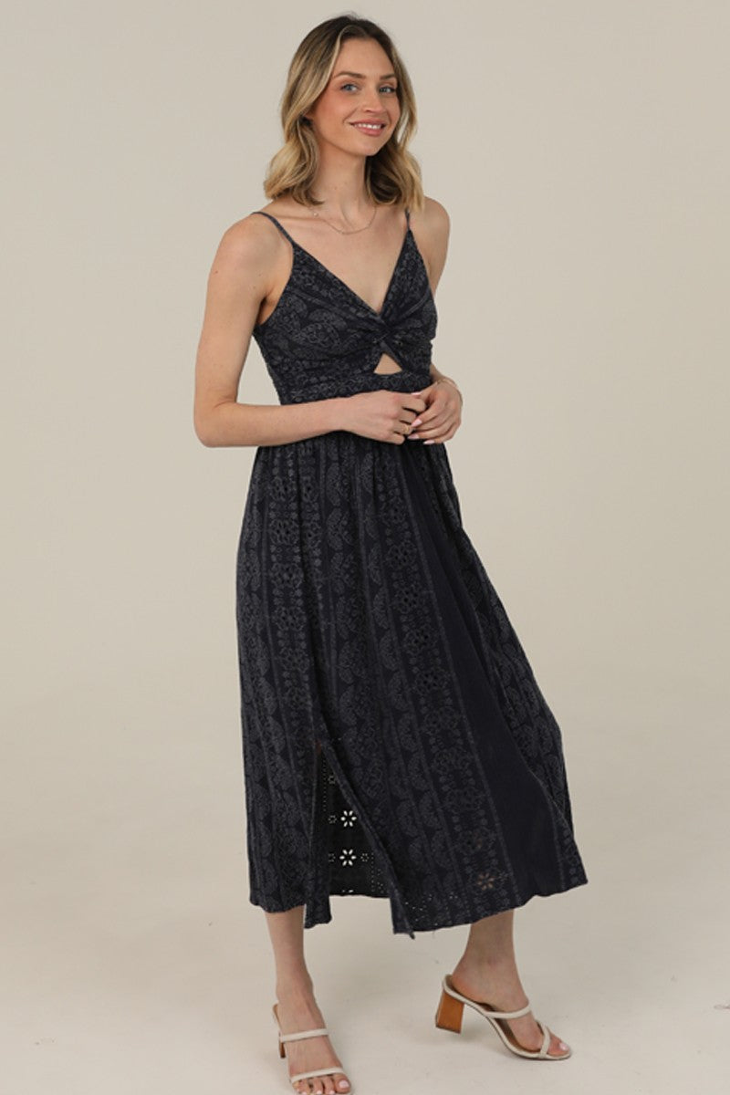  Midi Dress features a twist-front bodice, cutout detail, and eyelet embroidery 