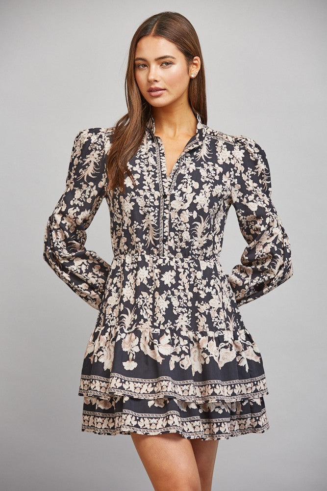 Floral border print midi dress featuring a banded mock collar, long bishop sleeves, lightweight woven fabric, and a flowing feminine silhouette.