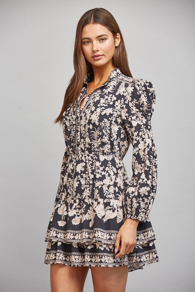 Floral border print midi dress featuring a banded mock collar, long bishop sleeves, lightweight woven fabric, and a flowing feminine silhouette.