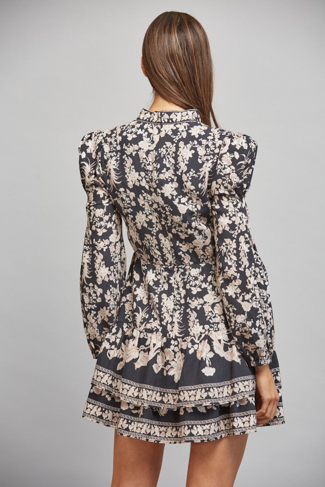 Floral border print midi dress featuring a banded mock collar, long bishop sleeves, lightweight woven fabric, and a flowing feminine silhouette.
