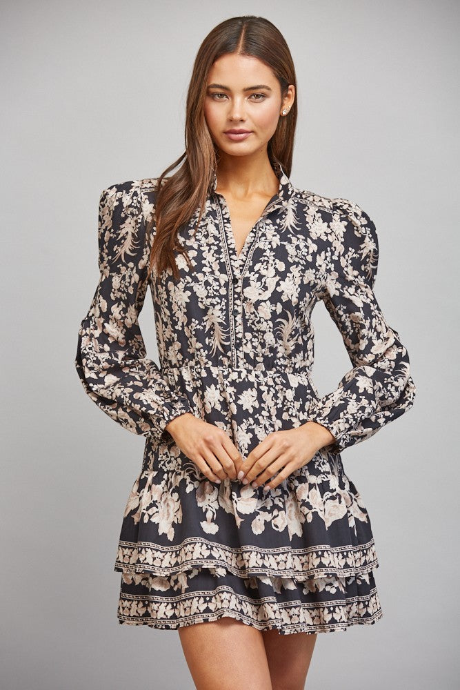 Floral border print midi dress featuring a banded mock collar, long bishop sleeves, lightweight woven fabric, and a flowing feminine silhouette.