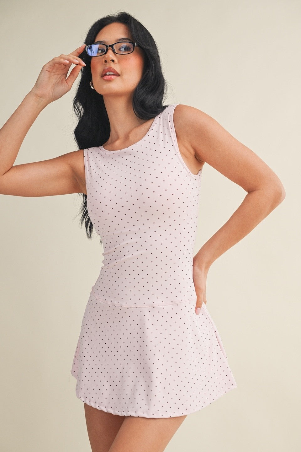 polka dot A-line mini dress with drop waist, soft stretch-knit fabric, and relaxed fit