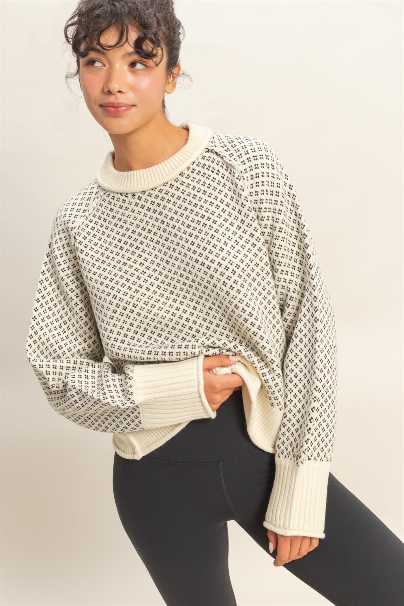A cozy mock-neck sweater with a refined geometric pattern for effortless style.