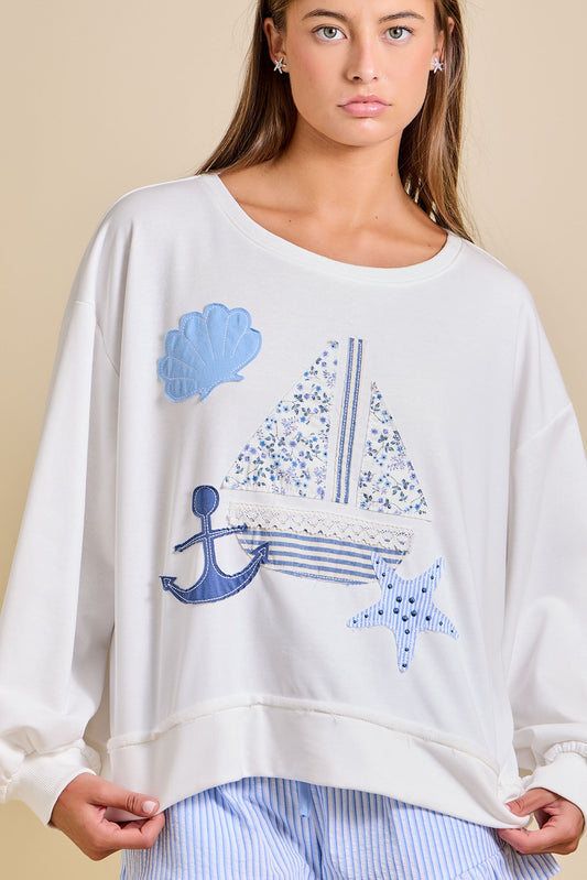 Oversized nautical sailboat patchwork sweatshirt in cotton blend fabric.