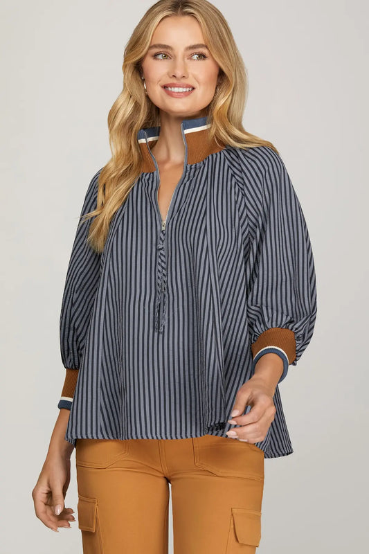 The Lenora Striped Half-Zip Top blends sporty ease with timeless stripes and versatile ¾ sleeves.