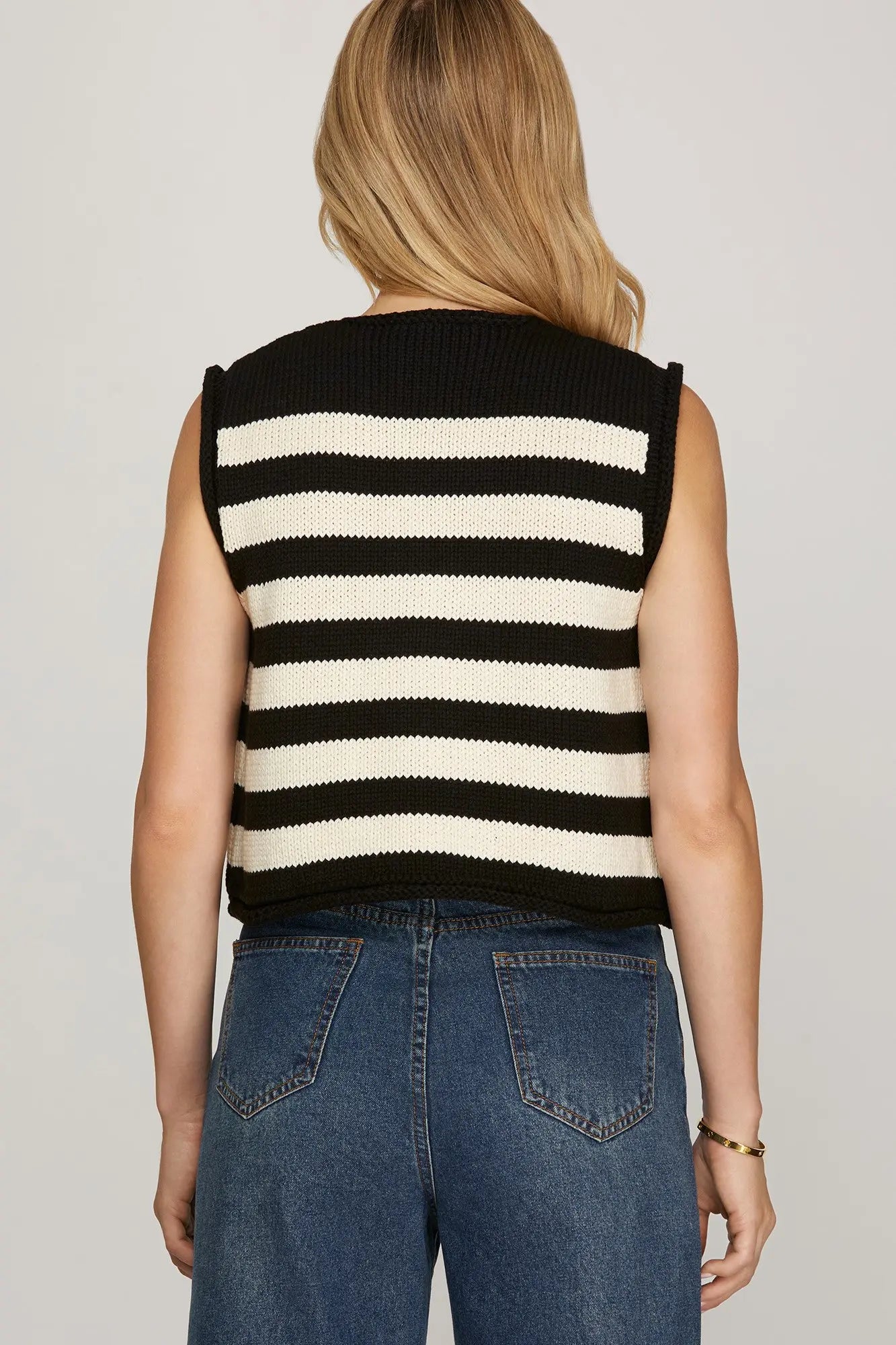 The Ottilie sweater vest updates classic stripes with a sleeveless button-down knit design.