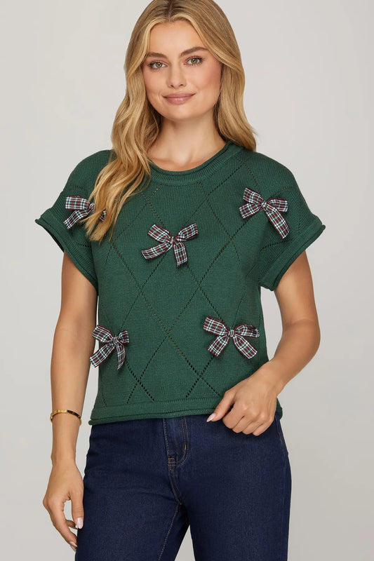The Emera Checked Bow Sweater Top brings playful charm with a chic bow detail and timeless check pattern.