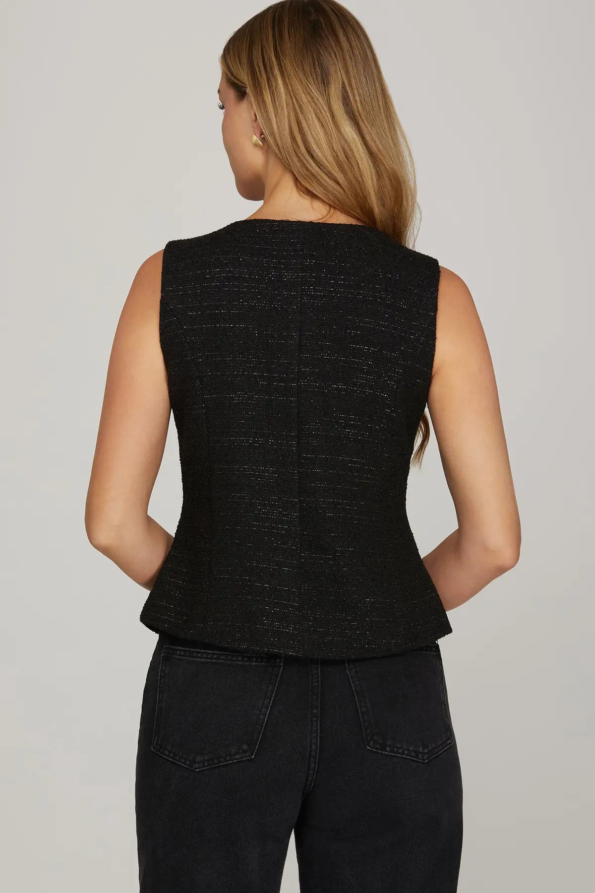 The Evadne Woven Tweed Vest offers timeless sophistication with a modern tailored edge.