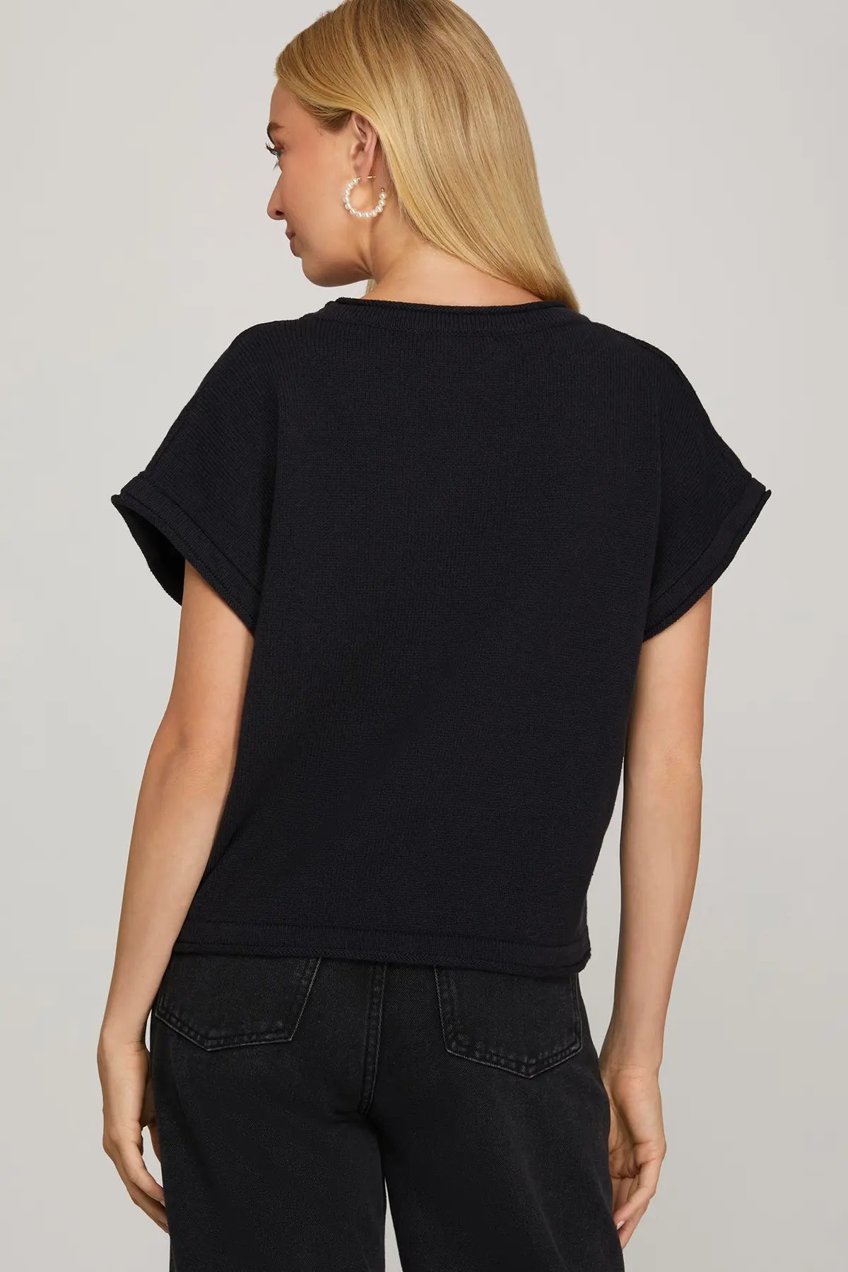 The Maribel Puppy Knit Sweater Top brings playful charm and cozy comfort together in a soft, relaxed silhouette.