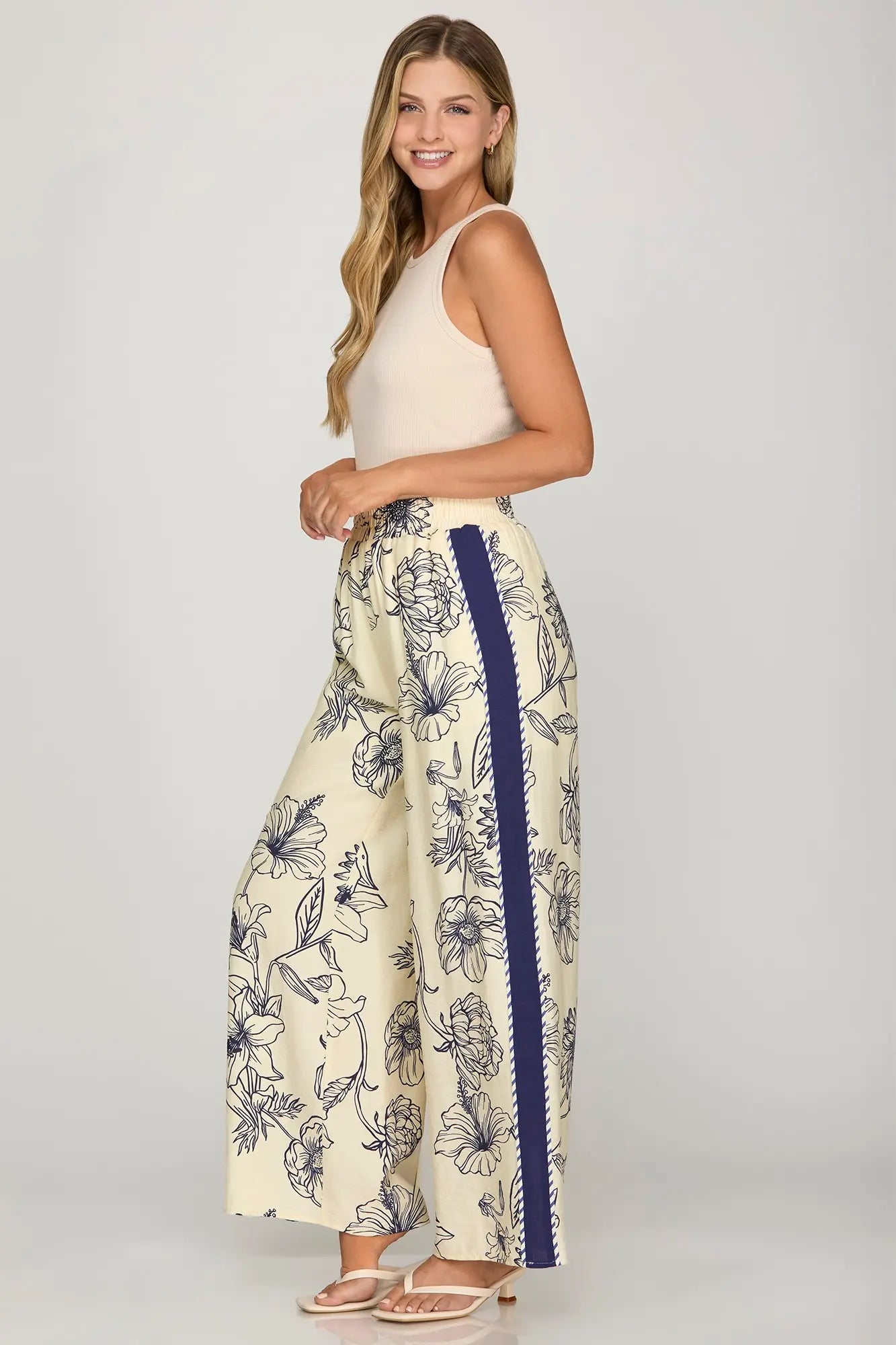 Woven print pants with contrast trim, elastic waistband, and pockets