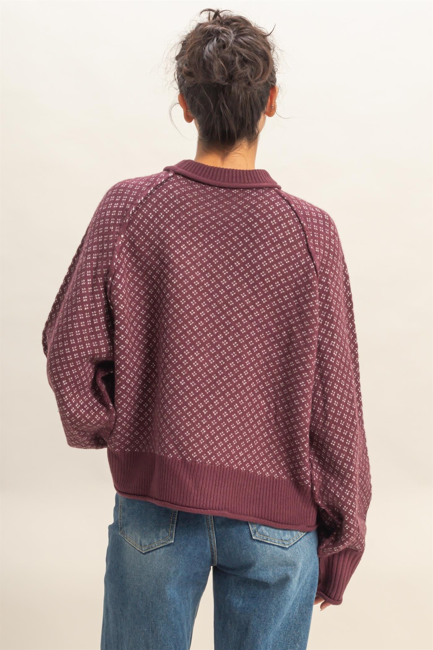 A cozy mock-neck sweater with a refined geometric pattern for effortless style.