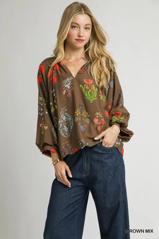 A feminine floral blouse with scalloped details and an easy, relaxed fit—perfect for effortless elegance.