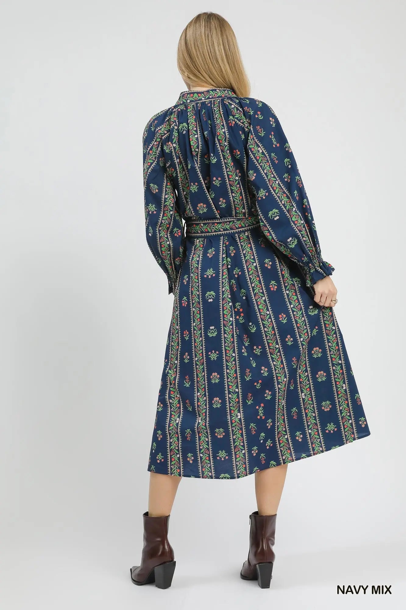 A statement-making cotton maxi dress that blends bohemian charm with timeless sophistication.
