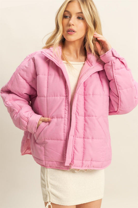 A sophisticated quilted puffer jacket with a stand collar, cozy fit, and timeless style for chilly days.
