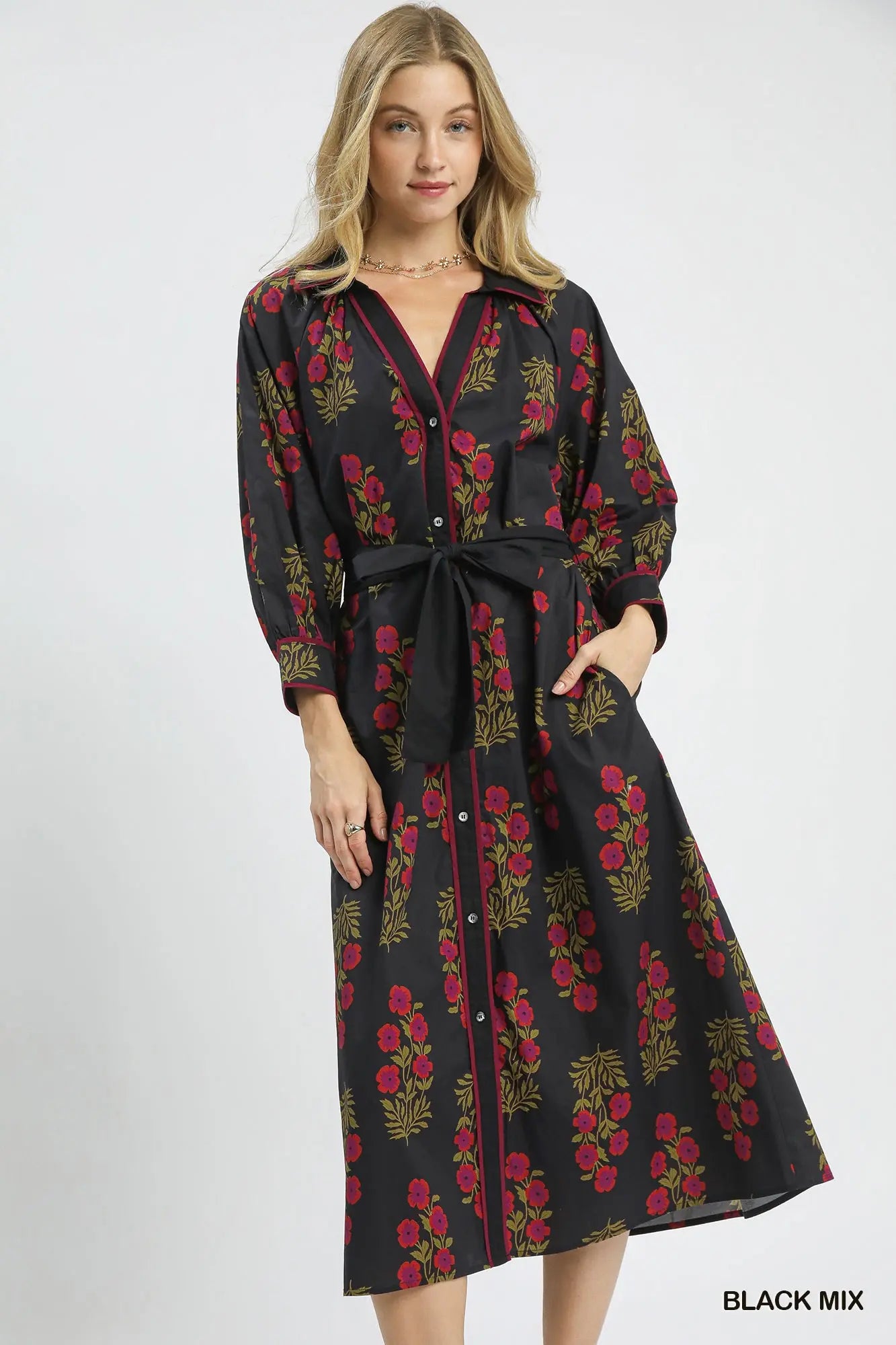 A timeless cotton maxi dress designed with effortless femininity and tailored polish.