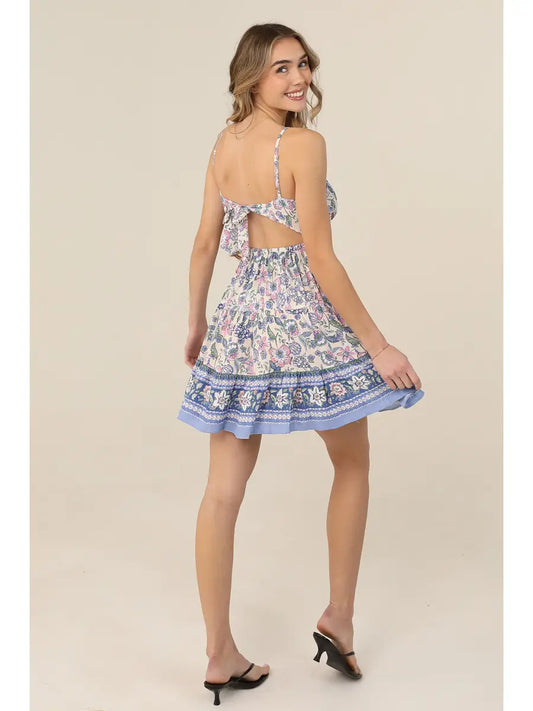 Sleeveless sundress featuring a fit-and-flare silhouette and tie-back detail