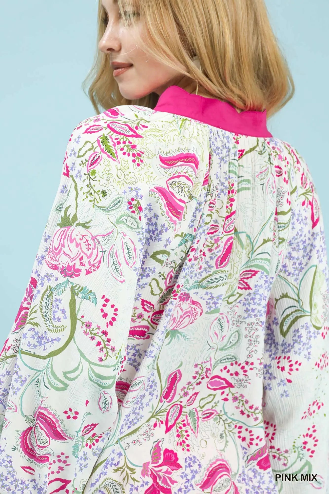 The Jessamine Paisley Floral Blouse captures vintage charm with its vibrant print and feminine silhouette.