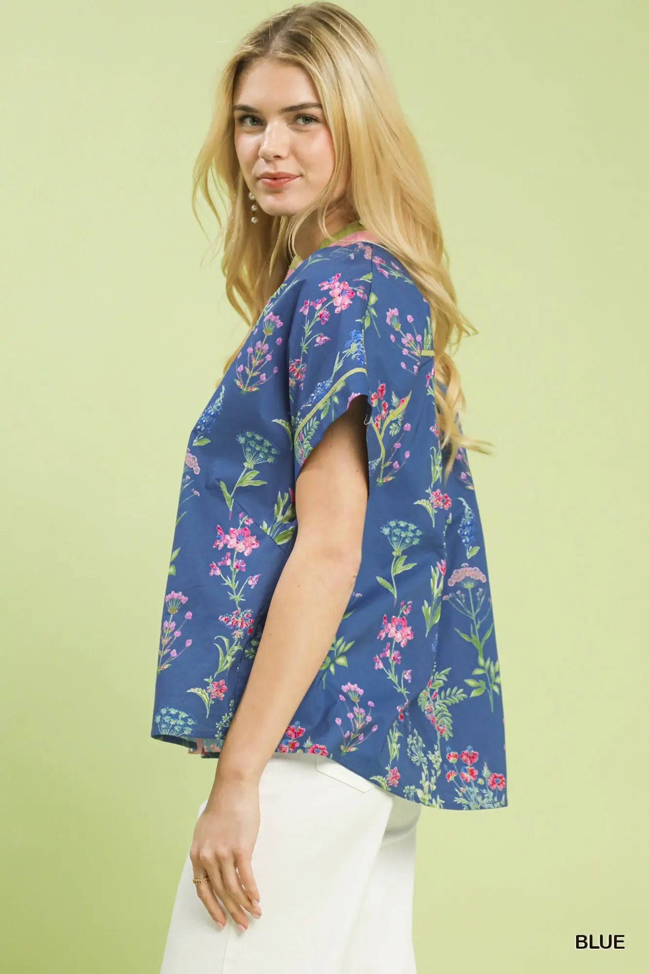 botanical floral blouse featuring contrast details and a classic button-front design