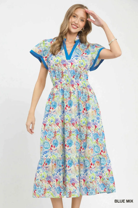 cotton midi dress featuring an abstract print, tiered skirt, and contrast trim details