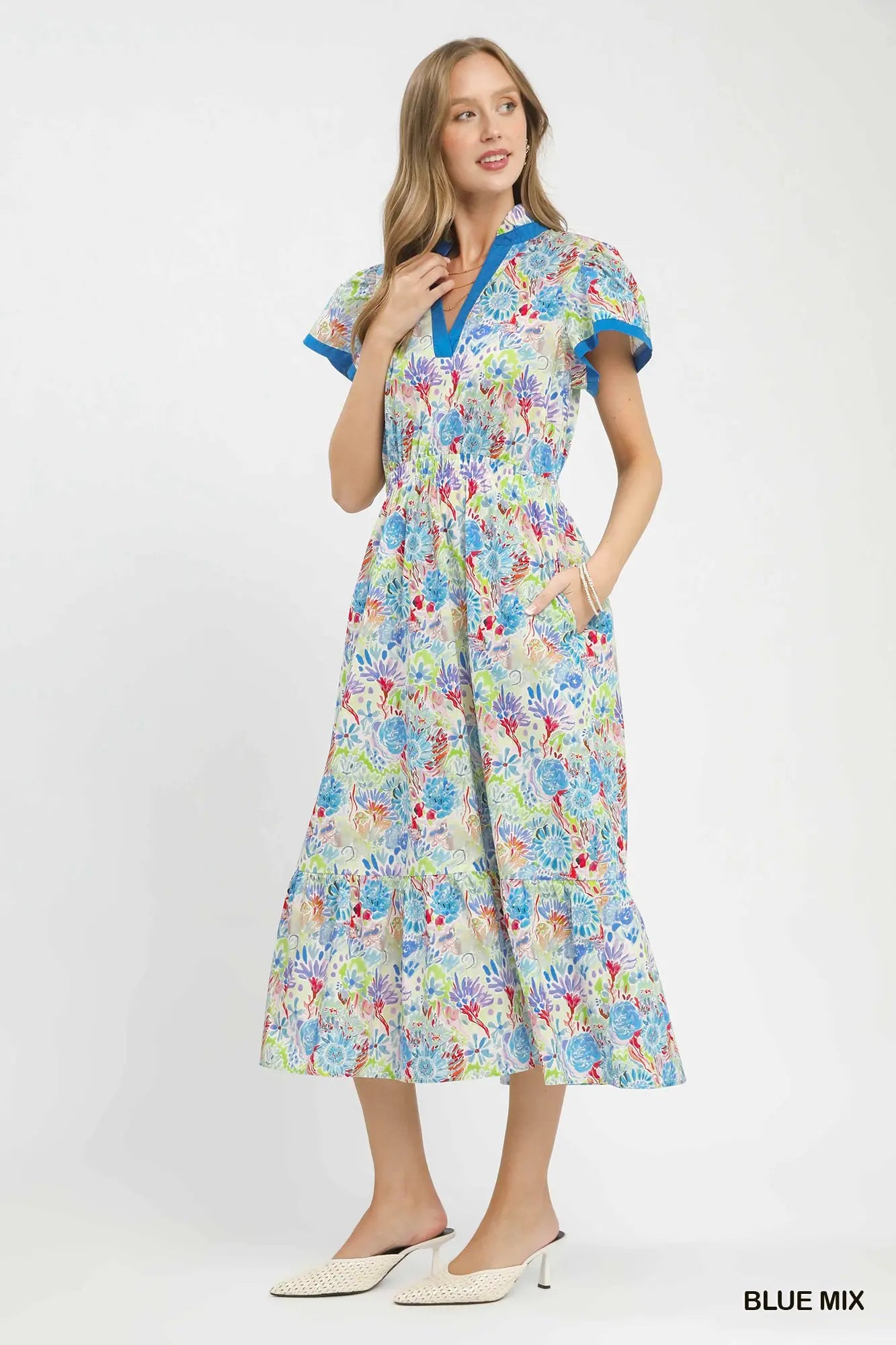 cotton midi dress featuring an abstract print, tiered skirt, and contrast trim details