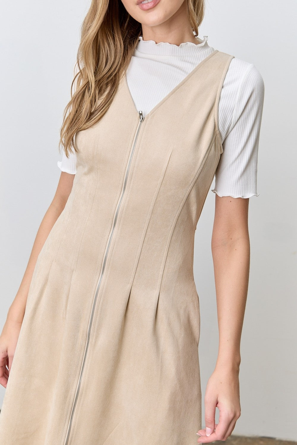 Sleeveless faux suede zip-front midi dress with pockets.