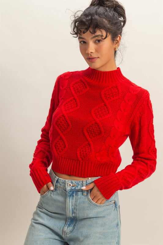 A timeless cable-knit sweater with a cozy, structured silhouette for effortless elegance.