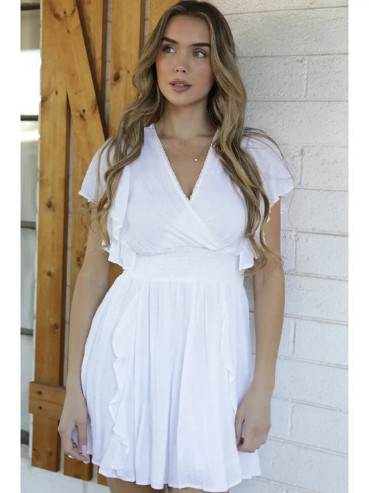 V-neck mini dress with Swiss dot texture and fit-and-flare silhouette