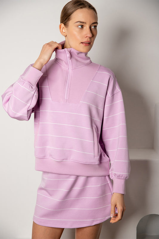 A silky-soft striped pullover with a mock neck, quarter zip, and kangaroo pocket for effortless comfort and style.