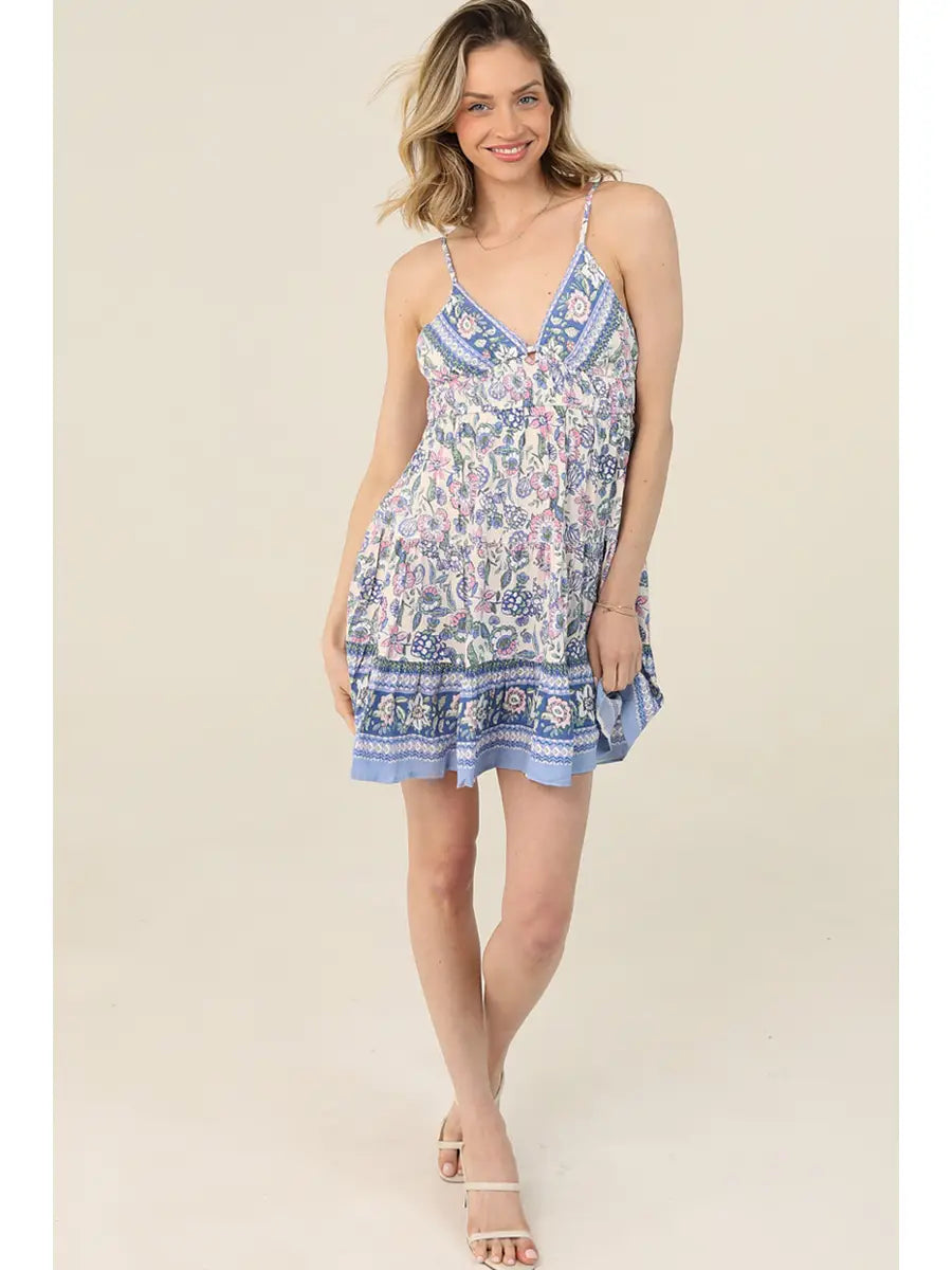 Sleeveless sundress featuring a fit-and-flare silhouette and tie-back detail
