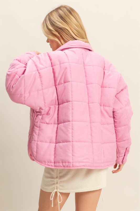A sophisticated quilted puffer jacket with a stand collar, cozy fit, and timeless style for chilly days.
