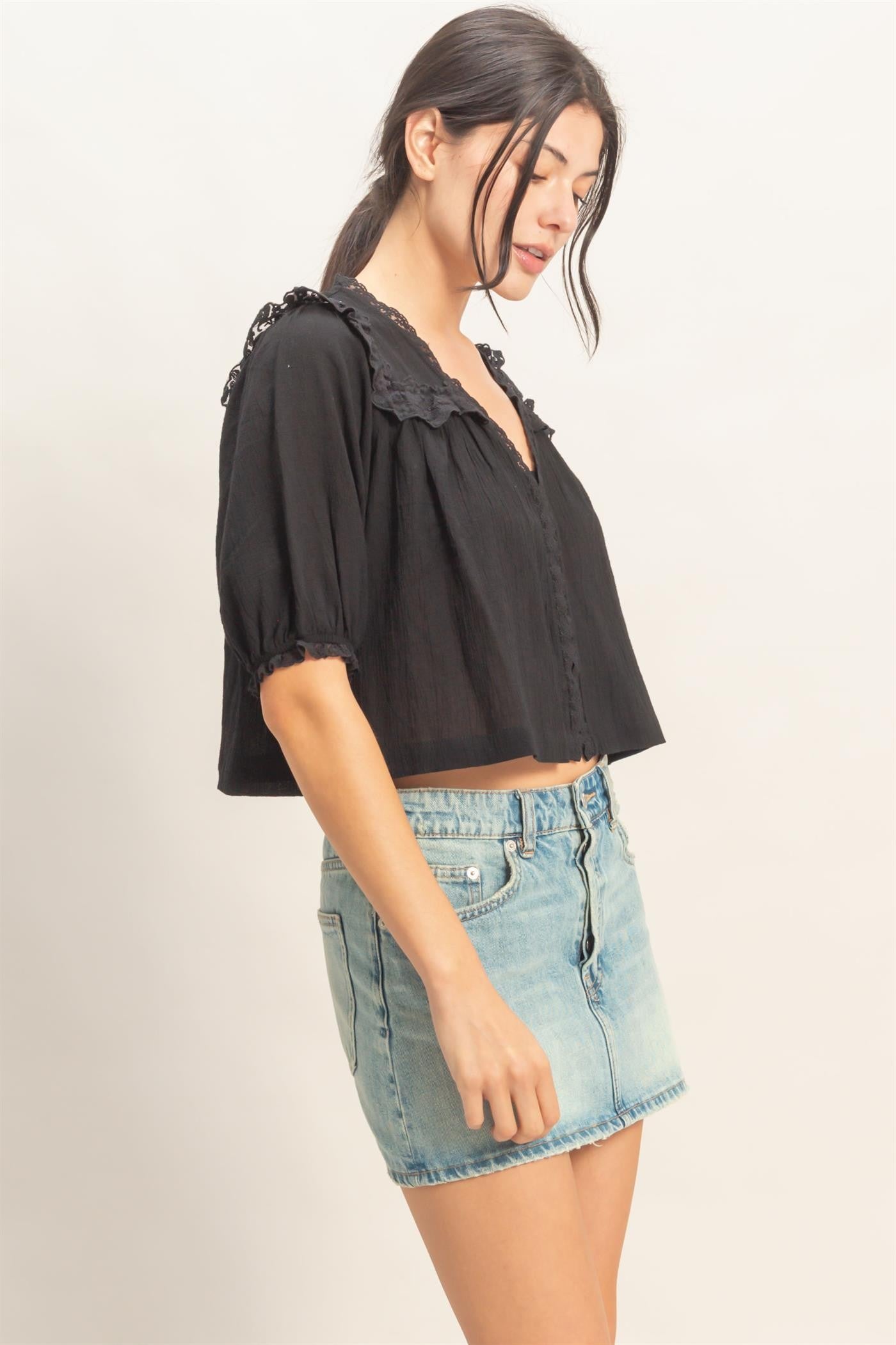  Lace Trim V-Neck Top features delicate ruffled lace accents and a relaxed silhouette 