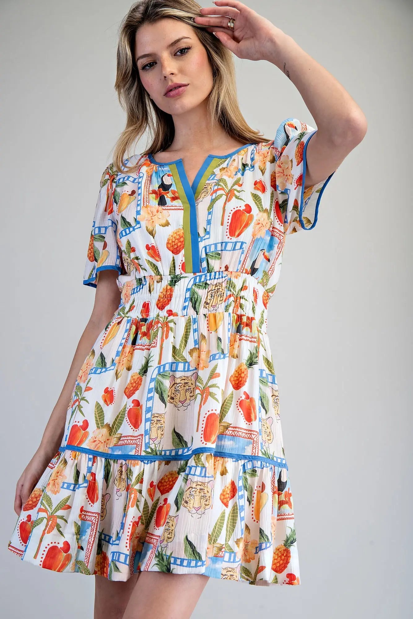 Tropical inspired split v-neck mini dress with smocked waist